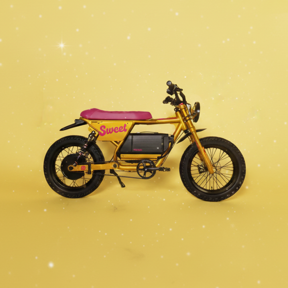 Small yellow motorcycle model on a yellow background