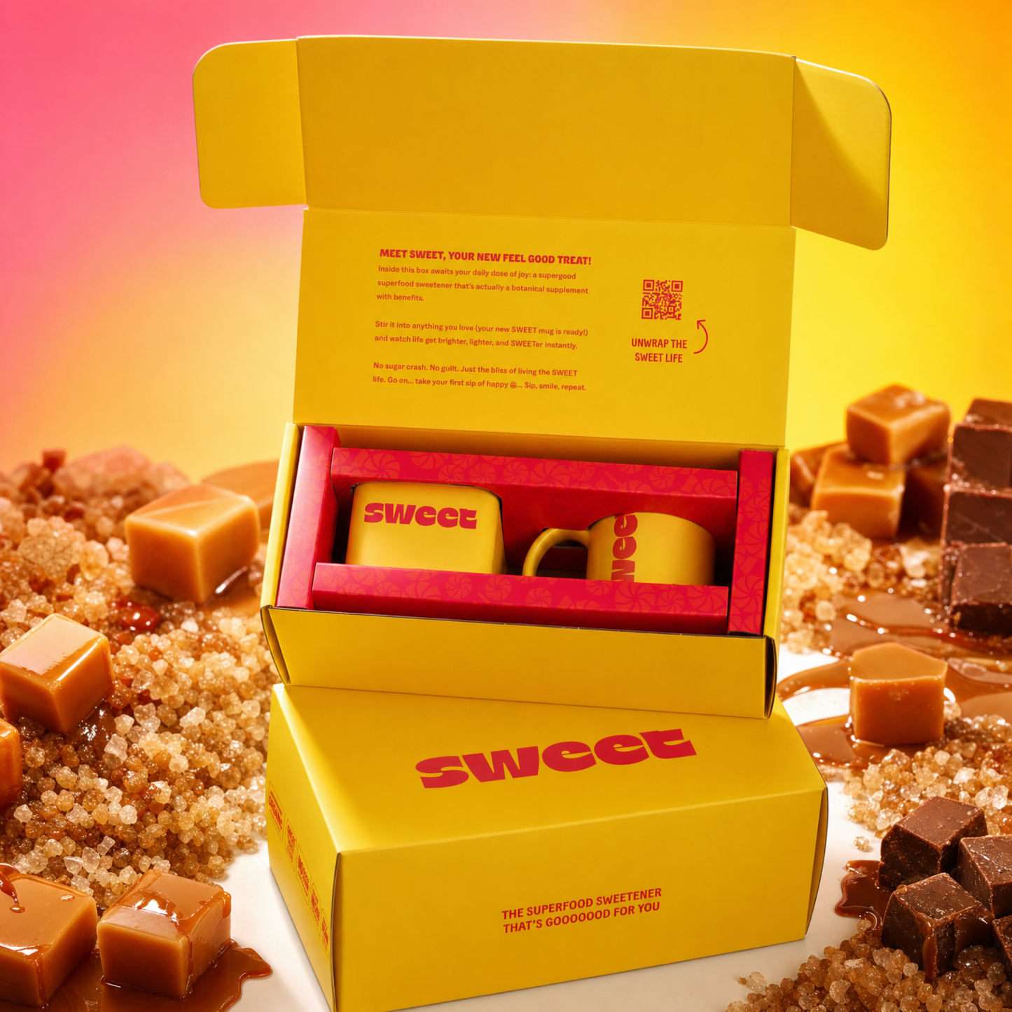 Two open yellow SWEET gift boxes with tins inside, surrounded by caramel cubes