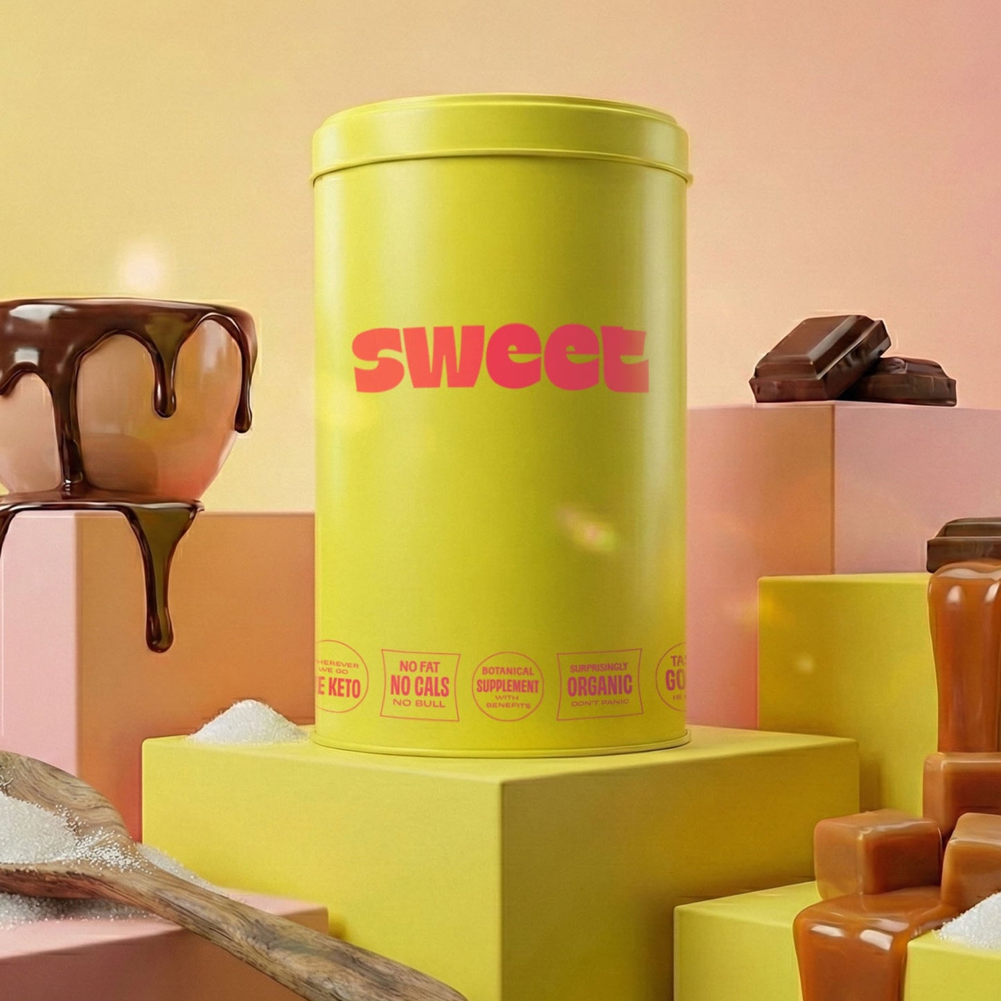 The SWEET Stash 1 Pounder — yellow 1 lb cylinder tin on a riser with a chocolate drip, caramel cubes, and raw sugar