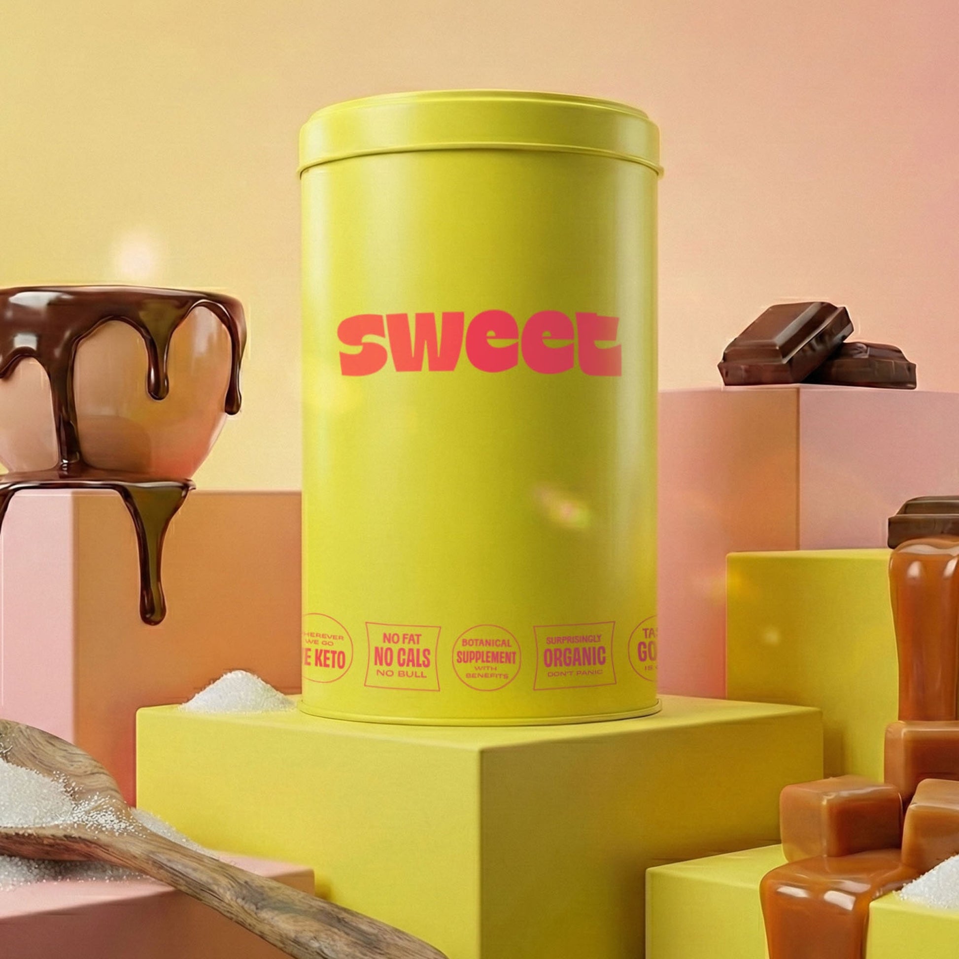 The SWEET Stash 1 Pounder — yellow 1 lb cylinder tin on a riser with a chocolate drip, caramel cubes, and raw sugar