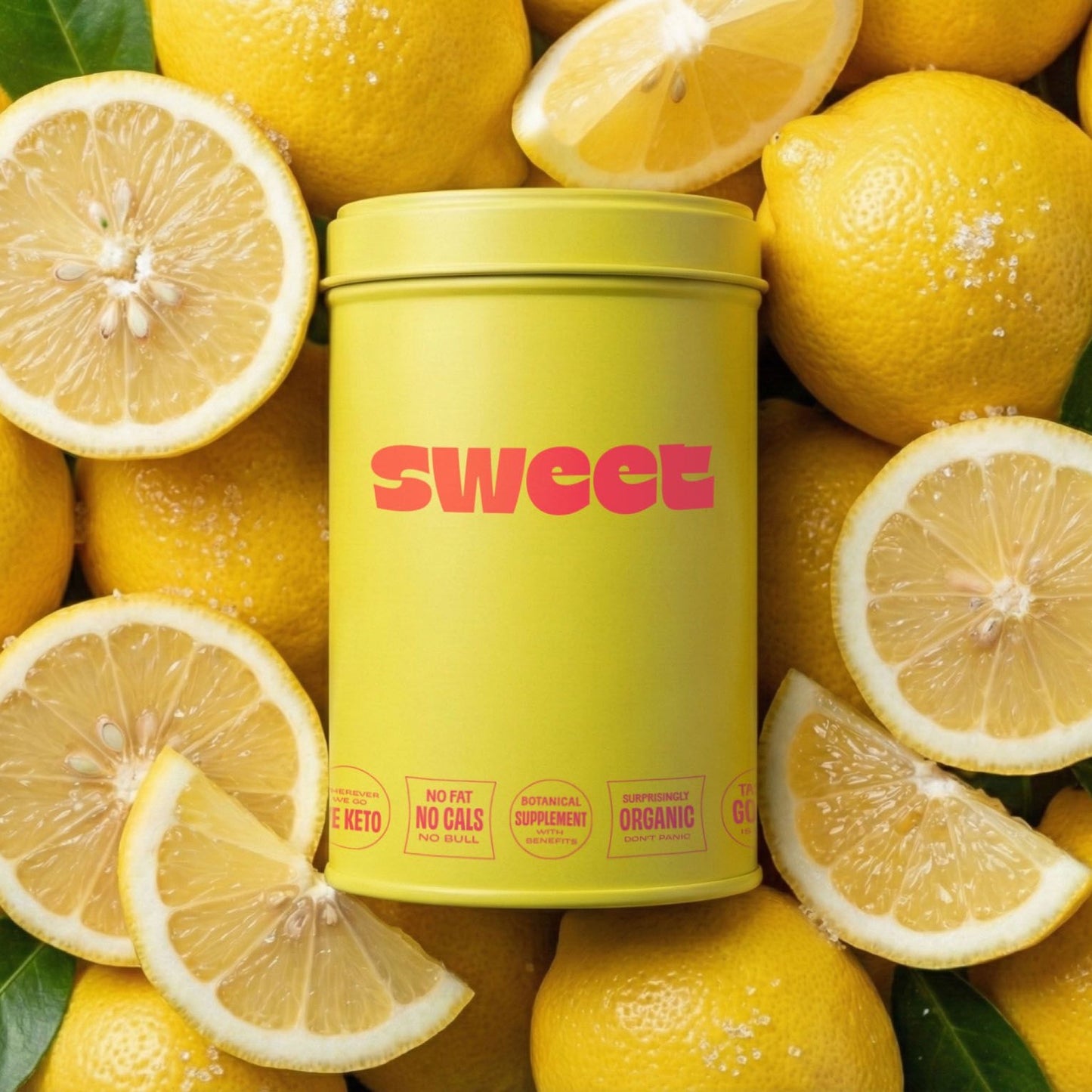 SWEET tin nestled among whole and sliced lemons with green leaves