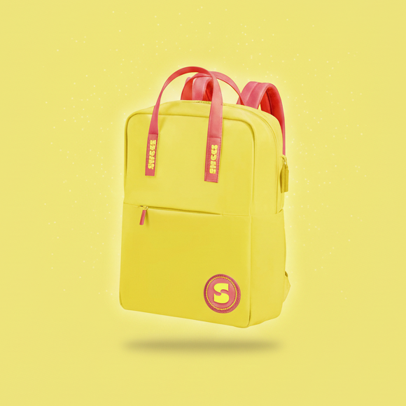 Yellow backpack with red straps on a yellow background